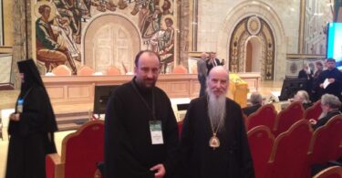 Deacon Andrew with Archbishop Mark at the SME plenum in January 2015.