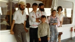 John Hudanish and his wife Elisabeth on the ferry in BC with Aleksei Revtov, Silvester Valikhov, Stepan Valikhov and Olga Valikhov.