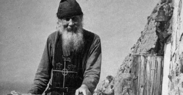 Father Theodosius on the terrace near the Holy Trinity Church he built