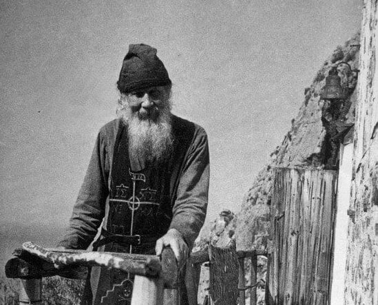 Father Theodosius on the terrace near the Holy Trinity Church he built