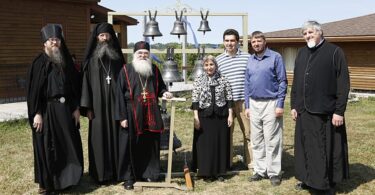 Father Nathaniel, Father Cassian, Abbott Luke, Aida-Elizabeth Airapetov, Michael Vertuoz, Andrei Diachkov and Nicolas Svetlovsky, a deacon from Rawdon, pose beside the new bells in the Hermitage of the Holy Annunciation in Nova Scotia