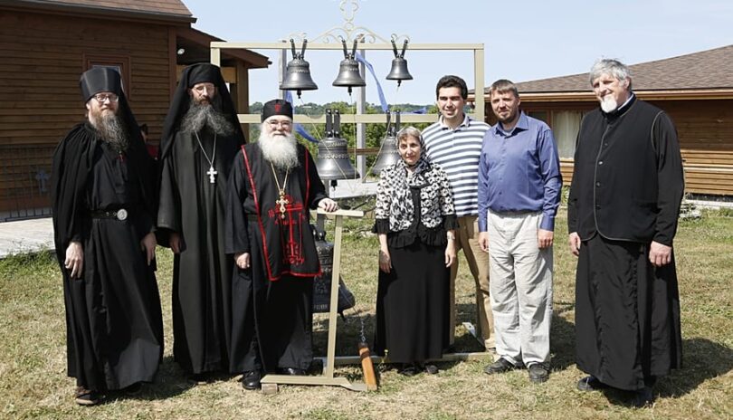 Father Nathaniel, Father Cassian, Abbott Luke, Aida-Elizabeth Airapetov, Michael Vertuoz, Andrei Diachkov and Nicolas Svetlovsky, a deacon from Rawdon, pose beside the new bells in the Hermitage of the Holy Annunciation in Nova Scotia